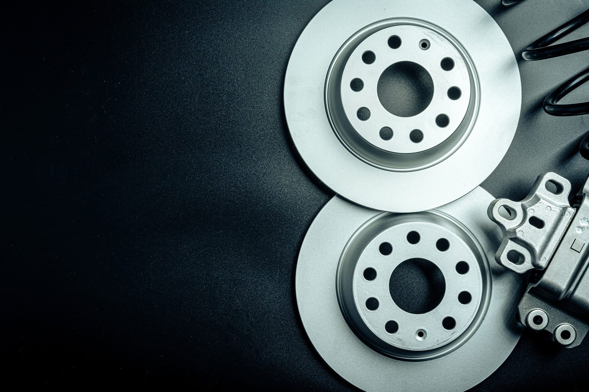 Close-up of a car brake disc and caliper relevant to brake repair services in Hamilton