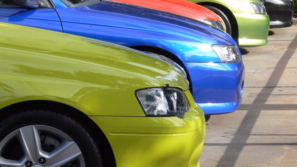 Car lot with various reliable compact and midsize cars for sale