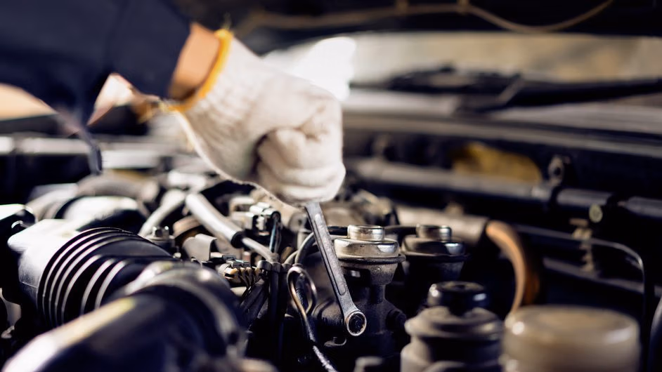 Mechanic inspecting a car during routine maintenance at CRS Automotive in Hamilton
