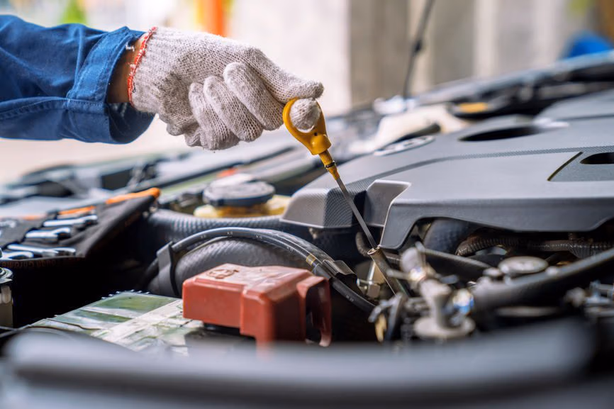Mechanic checking car tires and pressure at CRS Automotive in Hamilton