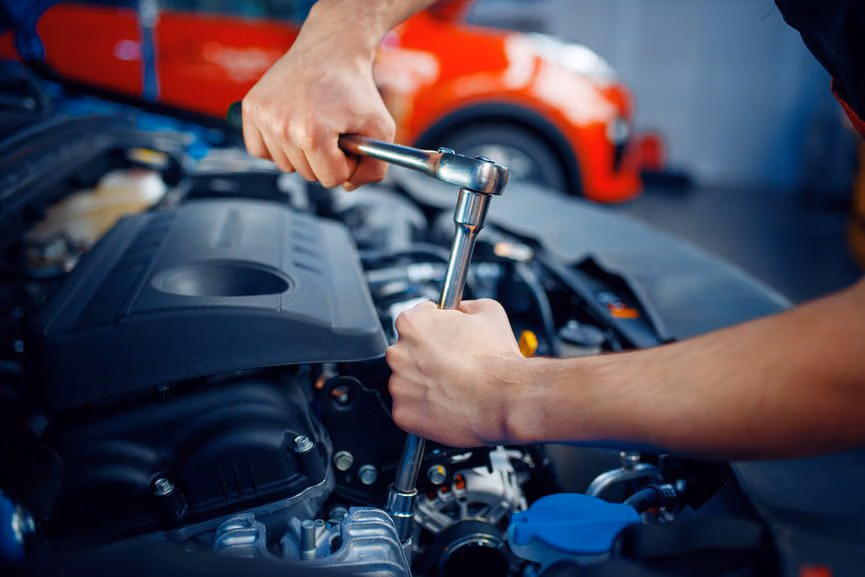 Technician performing vehicle service at CRS Automotive in Hamilton