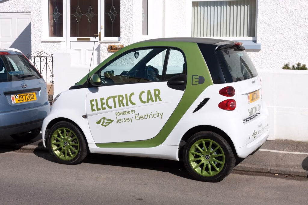 Electric car parked near charging station representing EV ownership costs
