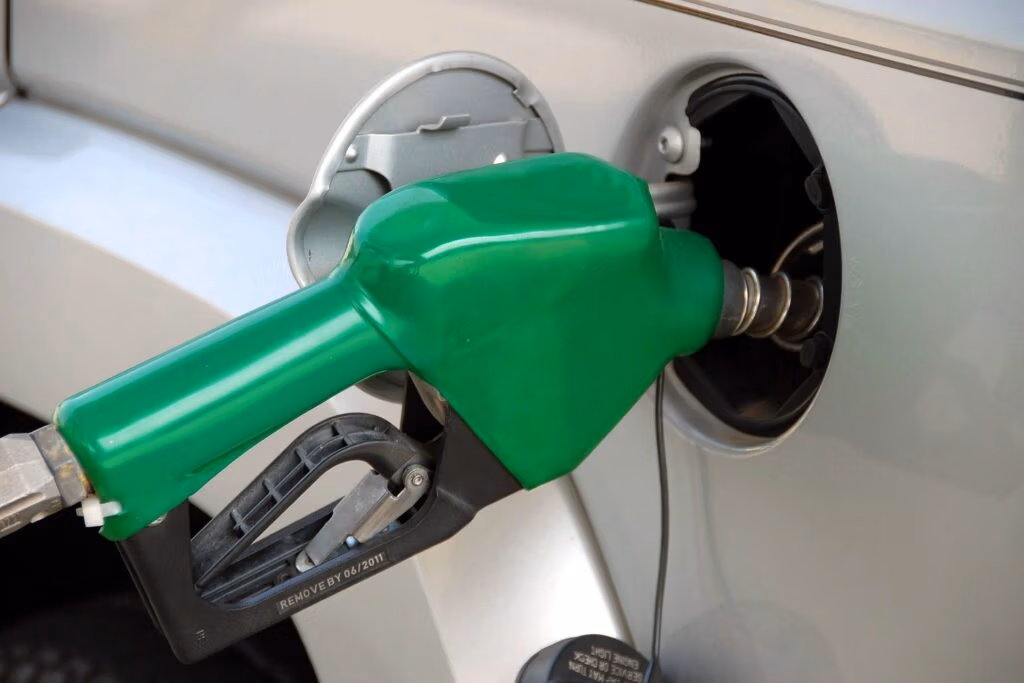 Car fuel economy concept with fuel pump and mileage indicators