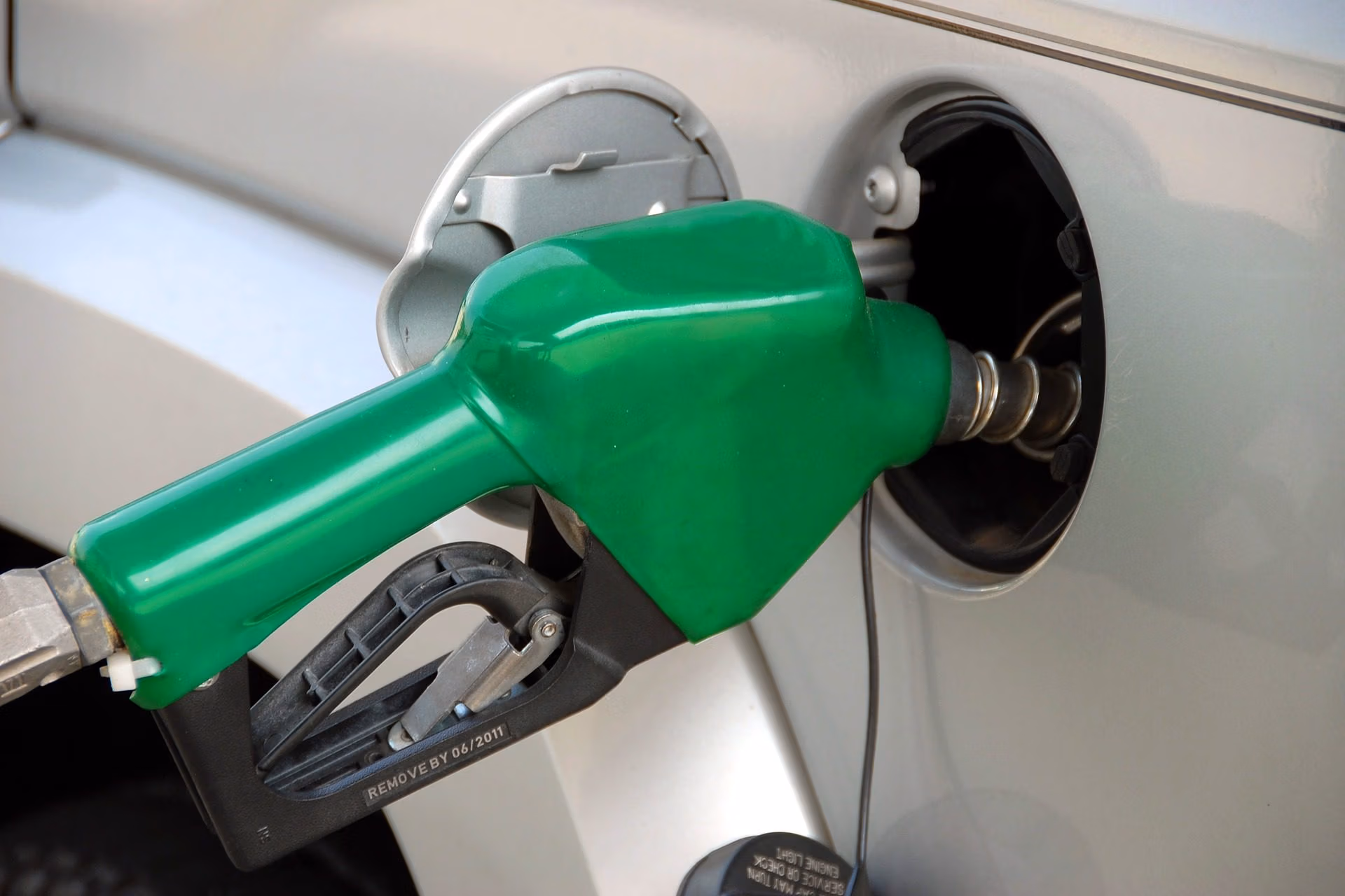 Car fuel economy concept with fuel pump and mileage indicators