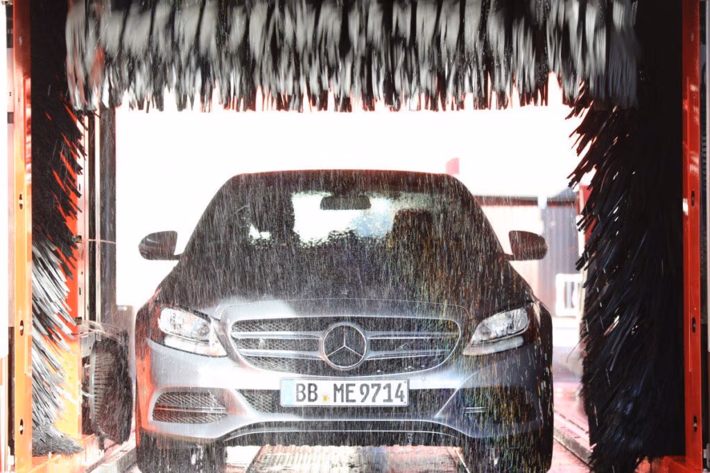 Car receiving thorough spring exterior wash to remove winter salt and debris