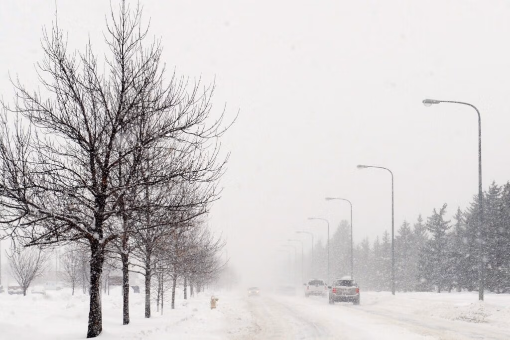 Car parked on a snowy road with winter tires