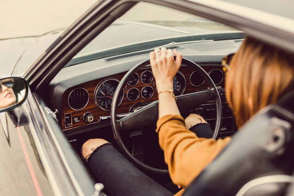 Woman driving a car, focused on safe vehicle operation